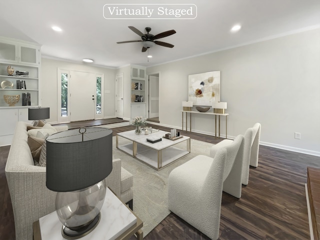 living room with dark hardwood / wood-style flooring, ceiling fan, and crown molding