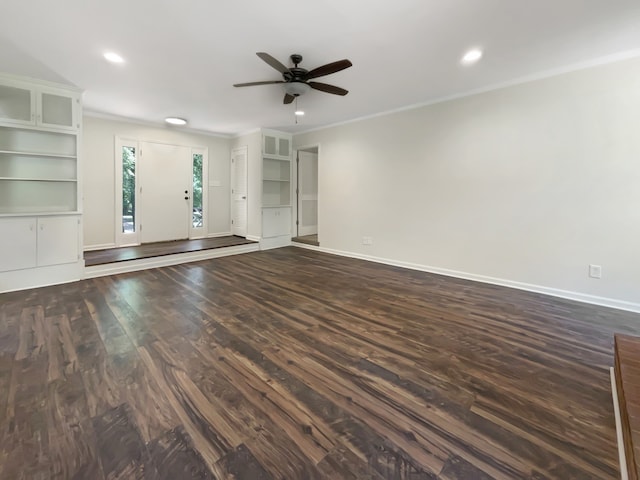 unfurnished living room featuring ornamental molding, dark hardwood / wood-style floors, built in shelves, and ceiling fan