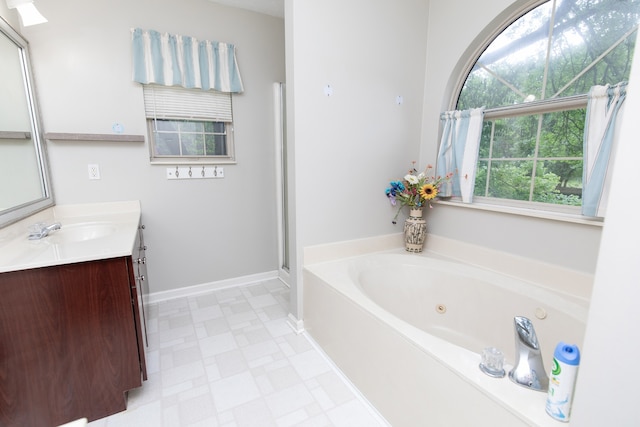 bathroom featuring tile flooring, plus walk in shower, and vanity