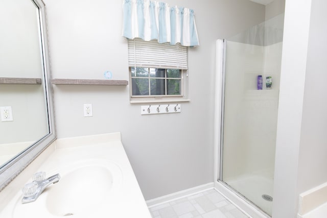 bathroom with tile floors, an enclosed shower, and vanity with extensive cabinet space