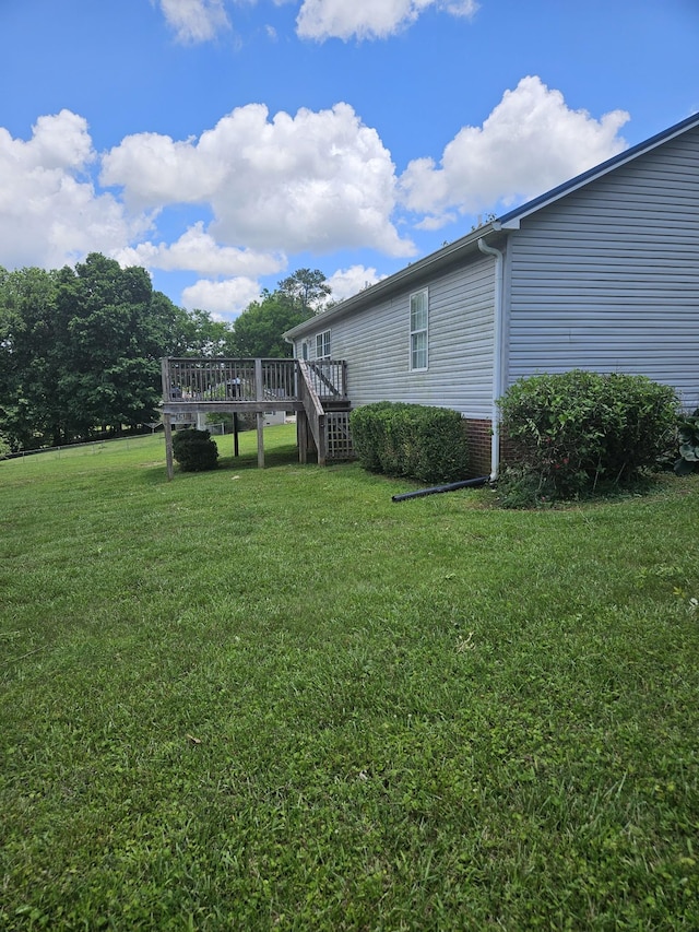 view of yard featuring a wooden deck