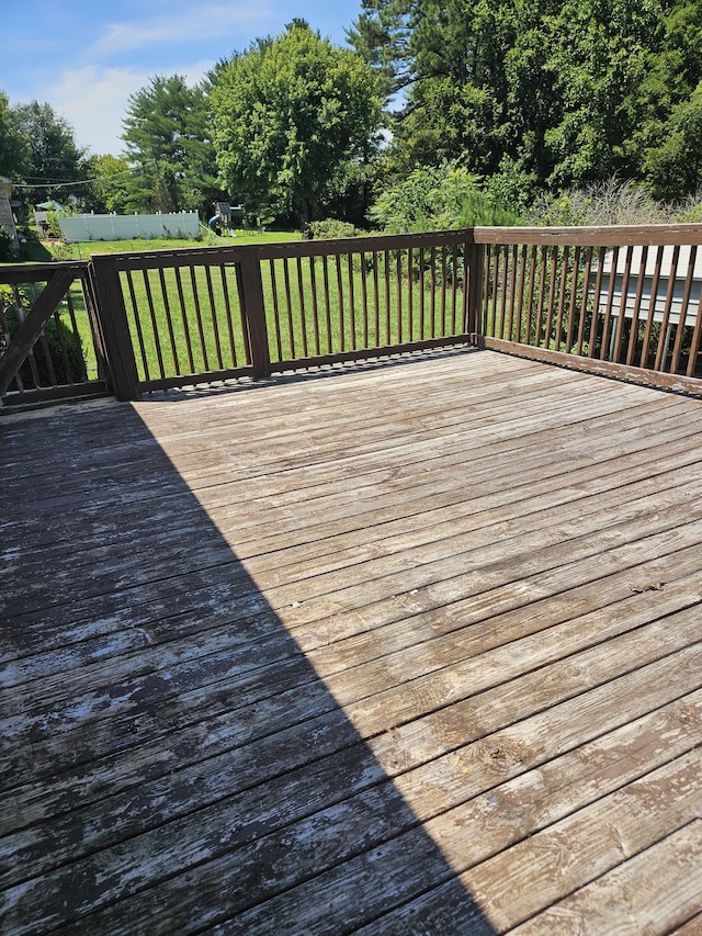 wooden terrace with a lawn