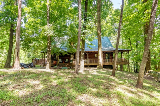 back of property featuring a wooden deck