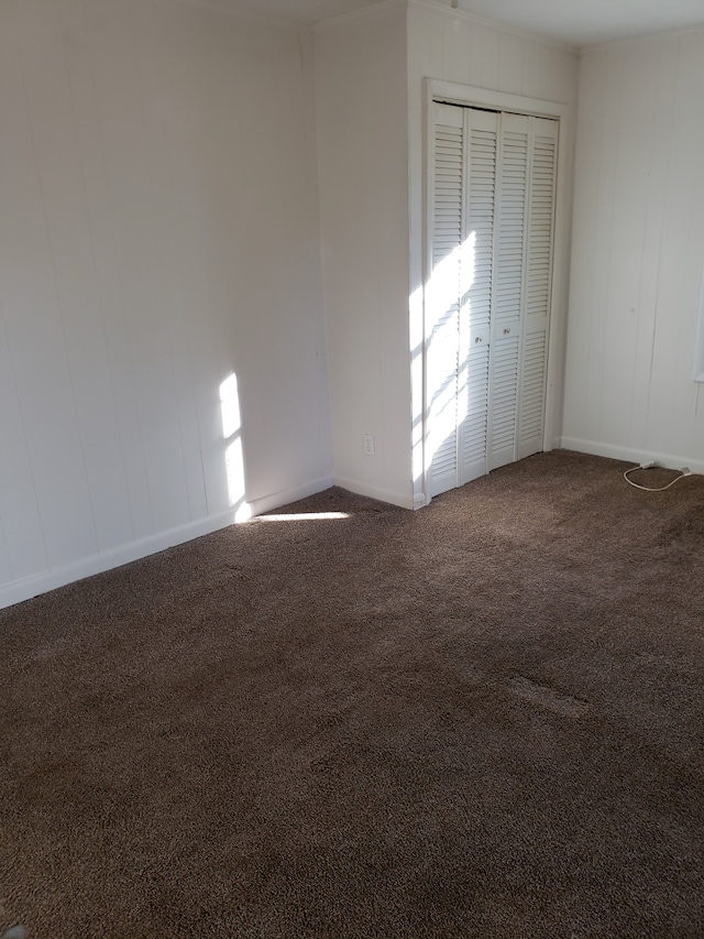 empty room with dark carpet