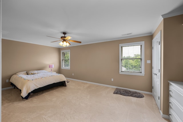 bedroom with light colored carpet, ornamental molding, and ceiling fan