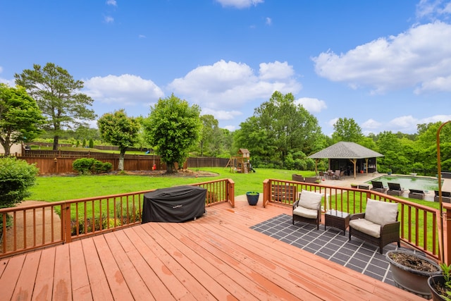 deck with a swimming pool and a lawn