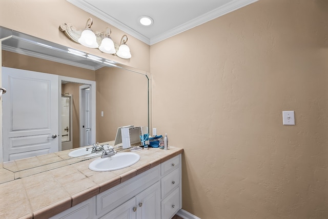 bathroom featuring ornamental molding and vanity