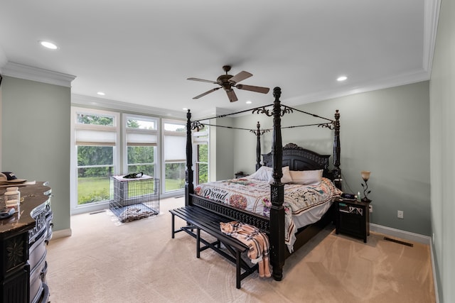 bedroom with ceiling fan, crown molding, and light colored carpet