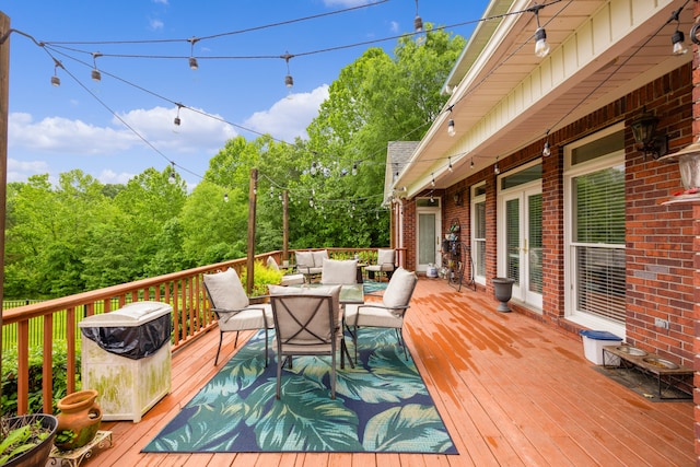 wooden terrace with outdoor lounge area