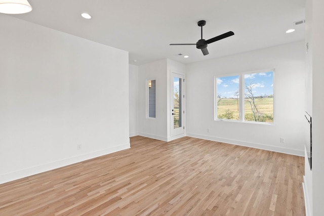 unfurnished room with ceiling fan and light hardwood / wood-style flooring