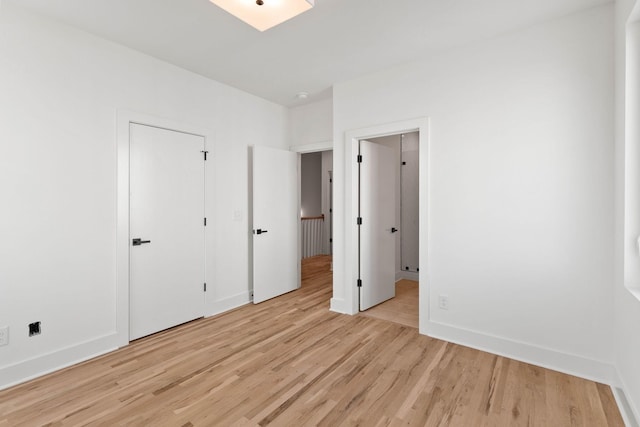 unfurnished bedroom featuring light hardwood / wood-style flooring