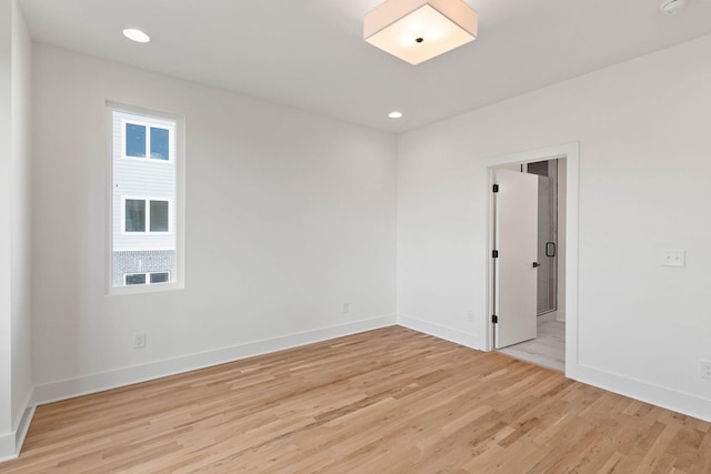 spare room with light hardwood / wood-style floors