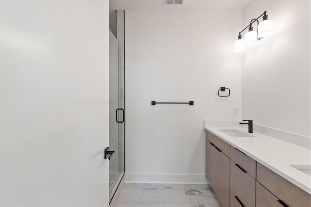 bathroom with vanity and an enclosed shower