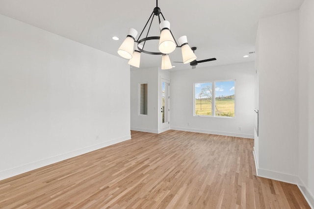 interior space with light hardwood / wood-style floors and a chandelier