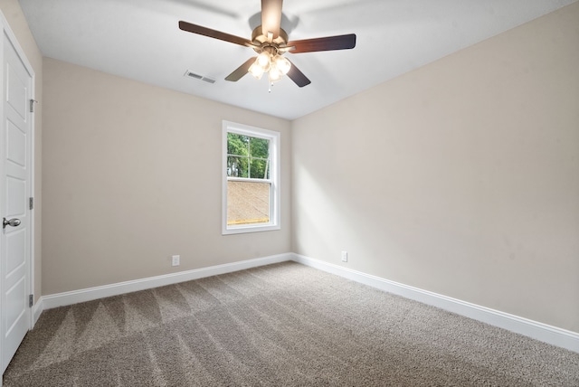 unfurnished room featuring ceiling fan and carpet floors