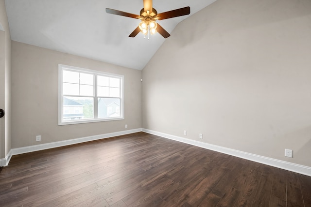 unfurnished room with dark wood-type flooring, ceiling fan, and vaulted ceiling