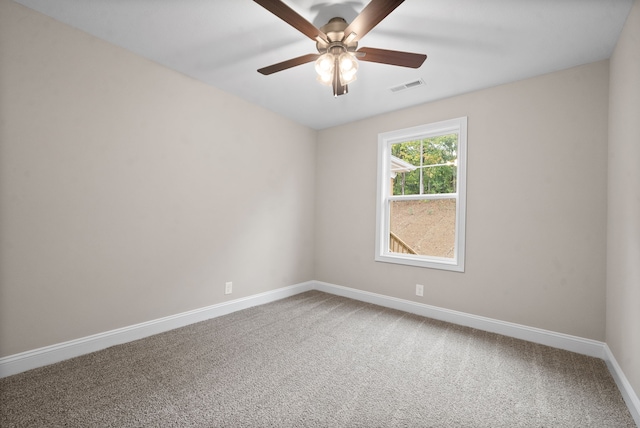 unfurnished room with carpet and ceiling fan