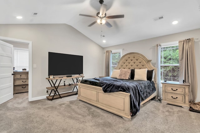 bedroom featuring ceiling fan, lofted ceiling, and light colored carpet