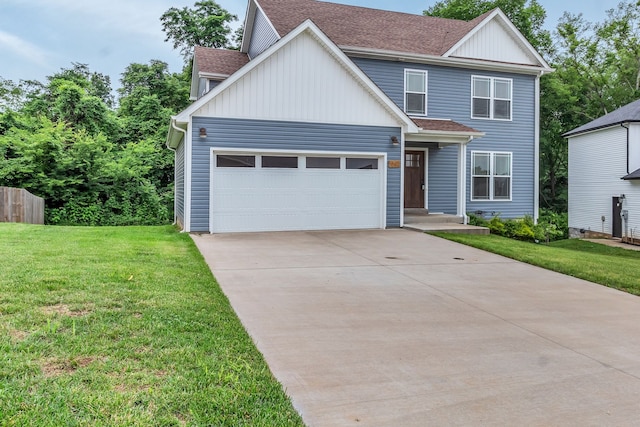 view of front of property with a front lawn and a garage