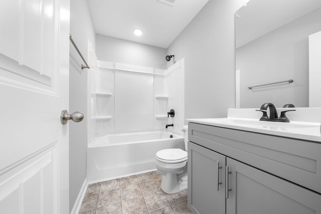 bathroom with toilet, vanity, tile patterned flooring, baseboards, and shower / bathtub combination