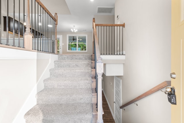 stairway featuring hardwood / wood-style floors