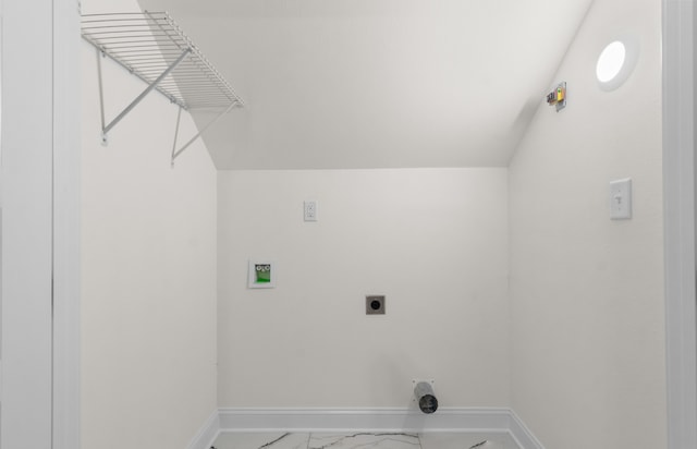 laundry area featuring electric dryer hookup and tile patterned floors