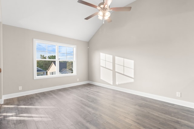 empty room with ceiling fan, high vaulted ceiling, and hardwood / wood-style floors