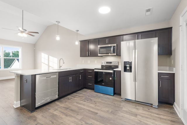 kitchen with sink, stainless steel appliances, light hardwood / wood-style floors, and ceiling fan