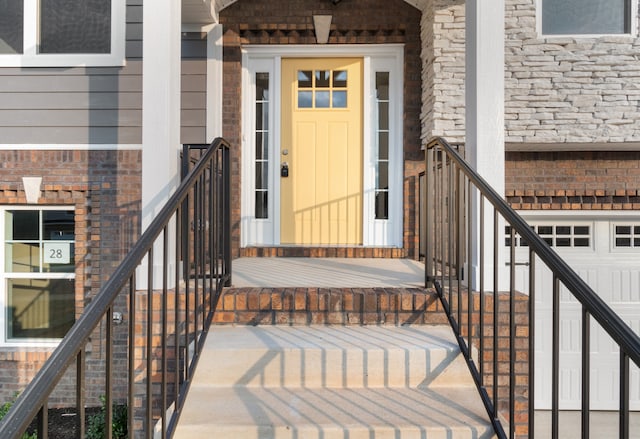 view of exterior entry with a garage