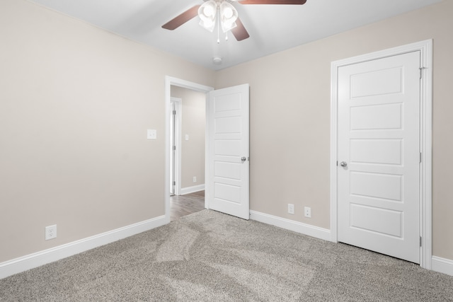 unfurnished bedroom with light colored carpet and ceiling fan