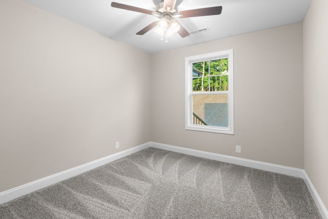 carpeted empty room featuring ceiling fan