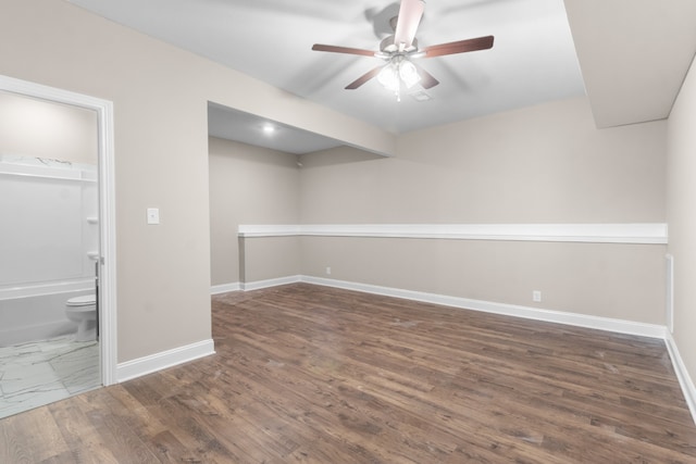 tiled empty room with ceiling fan