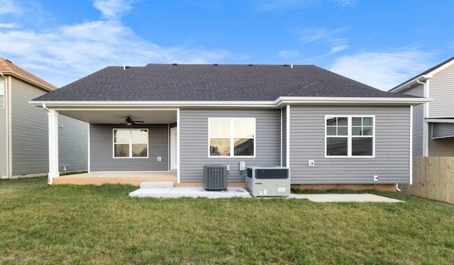 rear view of house with a patio area, a lawn, ceiling fan, and central air condition unit