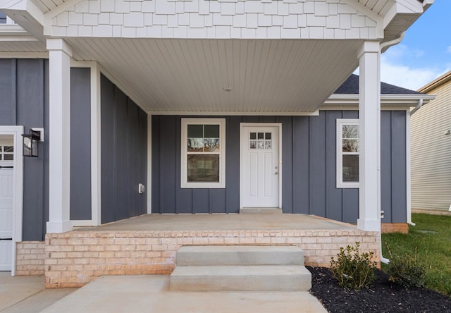 property entrance featuring covered porch