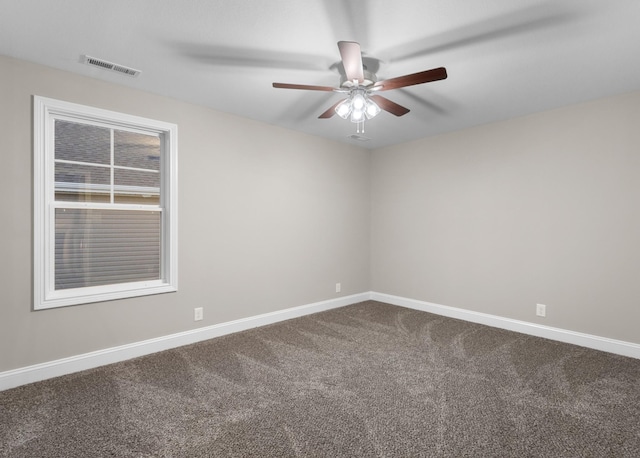 spare room featuring carpet and ceiling fan