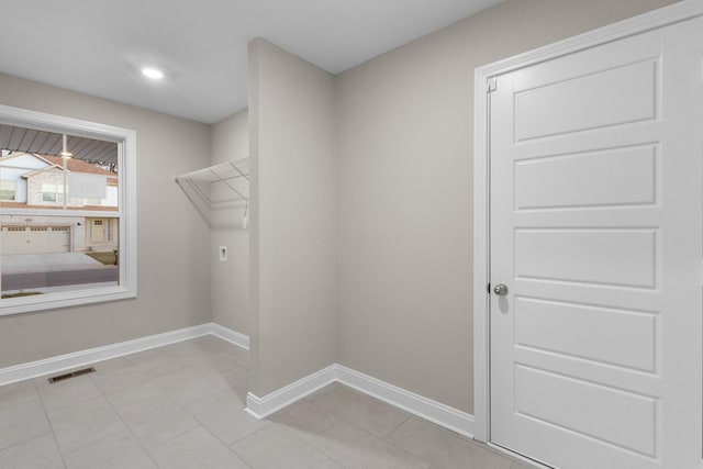 washroom with hookup for an electric dryer