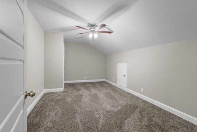 additional living space with carpet floors, lofted ceiling, and ceiling fan