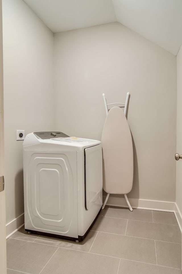 washroom featuring washer and dryer, light tile floors, and electric dryer hookup