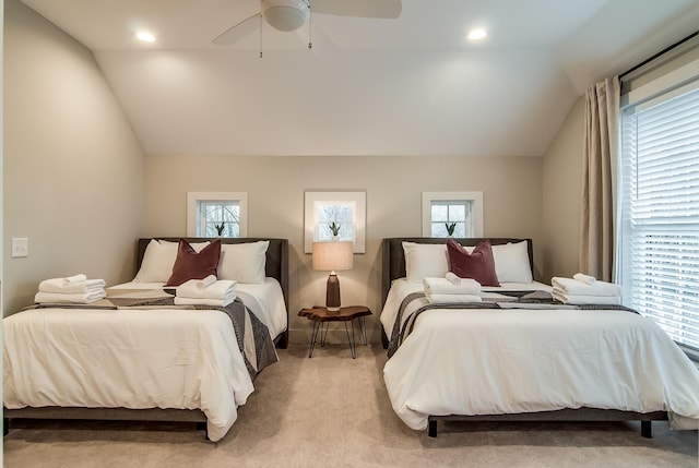 bedroom featuring lofted ceiling, carpet, and ceiling fan