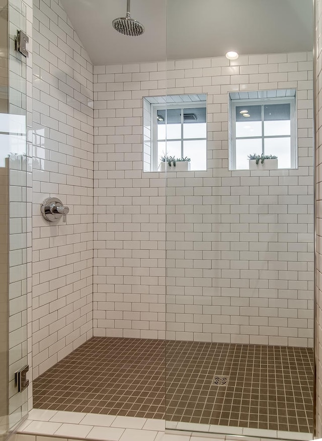 bathroom with a tile shower