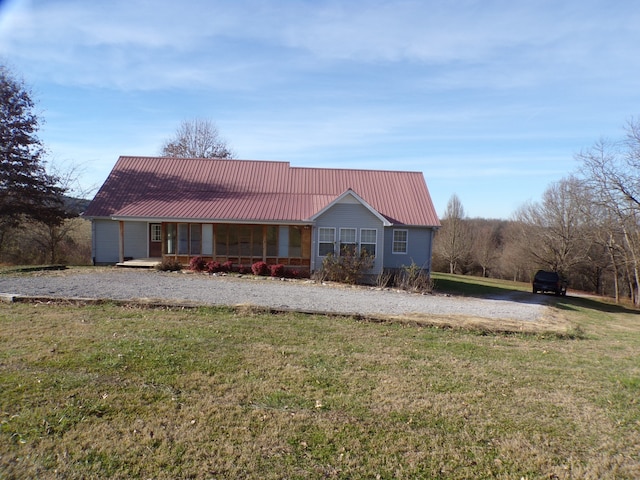 exterior space featuring a front yard and covered porch