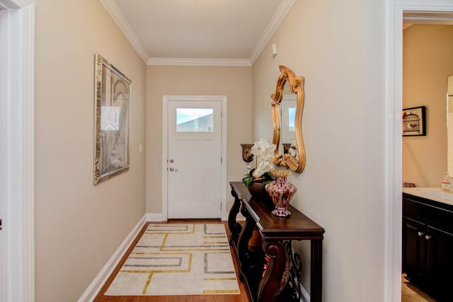 doorway to outside with light wood-type flooring and ornamental molding