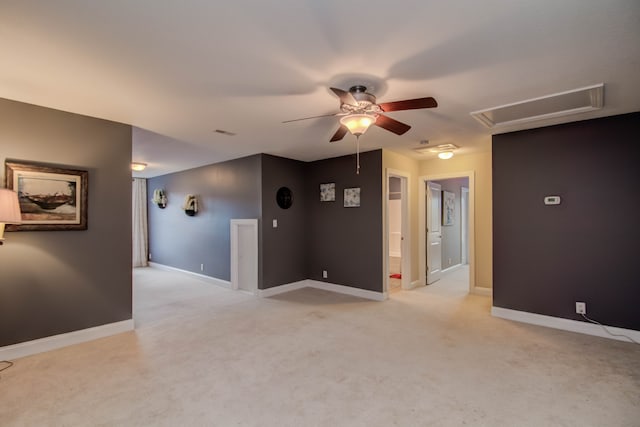 carpeted empty room featuring ceiling fan