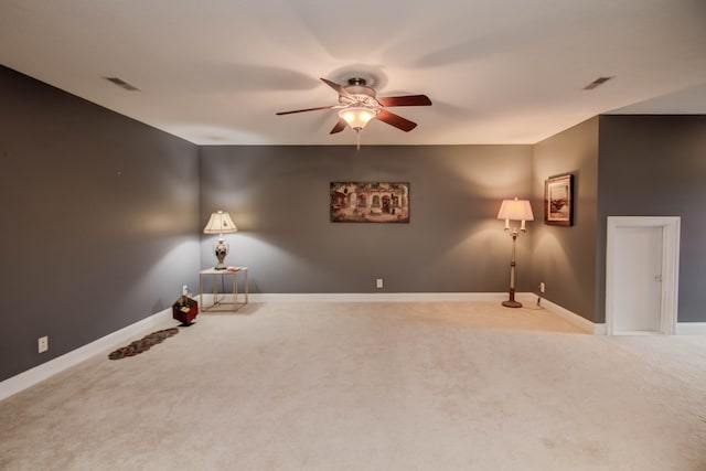 interior space with ceiling fan