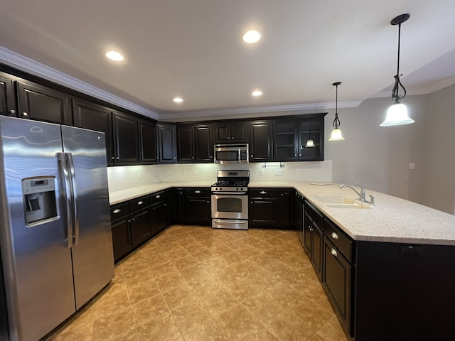 kitchen with sink, kitchen peninsula, crown molding, pendant lighting, and appliances with stainless steel finishes