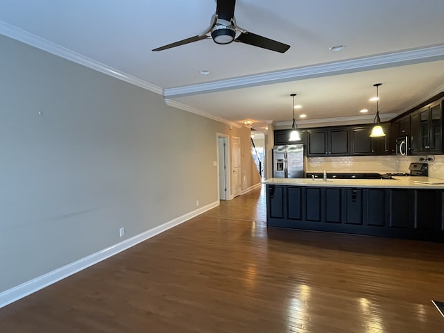 kitchen with decorative backsplash, ornamental molding, stainless steel appliances, dark wood-type flooring, and decorative light fixtures