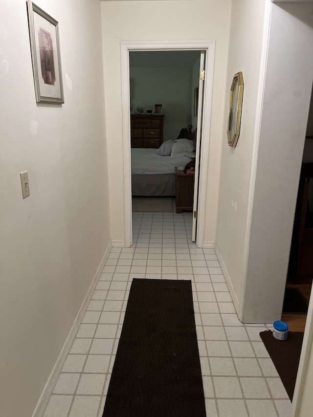 hallway featuring light tile patterned flooring