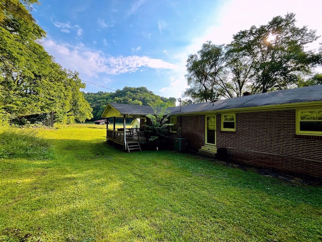 view of yard with central AC