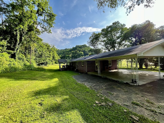 view of yard with a carport