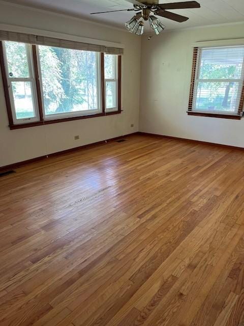 12 Arcot Rd, Celina, TN 38551 - spare room featuring wood finished floors, plenty of natural light, a ceiling fan, and baseboards